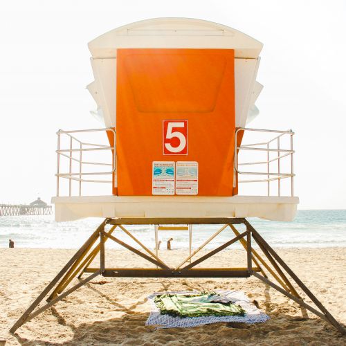 An orange lifeguard tower with a 